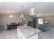 Open kitchen features a granite island, white cabinets, and stainless steel appliances at 12112 Helios Ave, Port Charlotte, FL 33981