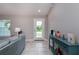 Bright living room with tiled floors and a view of the backyard at 12112 Helios Ave, Port Charlotte, FL 33981