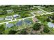 An aerial view of a house with a pool and a large yard at 12112 Helios Ave, Port Charlotte, FL 33981