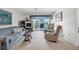 Living room with a view of the balcony and comfortable seating at 235 Rotonda Blvd W # C203, Rotonda West, FL 33947