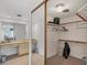 Well-lit walk-in closet with shelves and rods at 235 Rotonda Blvd W # C203, Rotonda West, FL 33947
