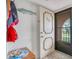Condo entryway with beach-themed decor at 235 Rotonda Blvd W # C203, Rotonda West, FL 33947