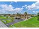 Exterior view of a multi-unit building with parking at 235 Rotonda Blvd W # C203, Rotonda West, FL 33947