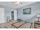 Serene bedroom featuring light blue walls and a ceiling fan at 235 Rotonda Blvd W # C203, Rotonda West, FL 33947