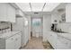 Clean and bright kitchen with white cabinetry and modern appliances at 235 Rotonda Blvd W # C203, Rotonda West, FL 33947