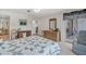 Bedroom with a queen bed, dresser, and access to balcony at 235 Rotonda Blvd W # C203, Rotonda West, FL 33947