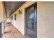 Condo hallway with tiled floors and access to unit at 235 Rotonda Blvd W # C203, Rotonda West, FL 33947