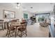 Living room with dining area, comfy seating, and balcony view at 235 Rotonda Blvd W # C203, Rotonda West, FL 33947