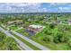Aerial view of a multi-unit building and surrounding area at 235 Rotonda Blvd W # C203, Rotonda West, FL 33947