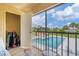 Screened balcony with pool and community views at 235 Rotonda Blvd W # C203, Rotonda West, FL 33947