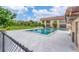 Refreshing community pool with surrounding patio at 235 Rotonda Blvd W # C203, Rotonda West, FL 33947