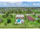 Wide aerial view showing community pool and neighborhood at 235 Rotonda Blvd W # C203, Rotonda West, FL 33947