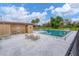Inviting community pool with lounge chairs and lush landscaping at 235 Rotonda Blvd W # C203, Rotonda West, FL 33947