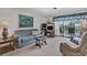 Living room with patio access and relaxing furniture at 235 Rotonda Blvd W # C203, Rotonda West, FL 33947