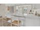Kitchen with white cabinets and a breakfast bar at 235 Rotonda Blvd W # C203, Rotonda West, FL 33947