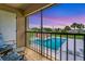 Relaxing patio overlooking a community pool with sunset views at 235 Rotonda Blvd W # C203, Rotonda West, FL 33947