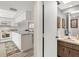 Kitchen with white cabinets and a breakfast bar at 235 Rotonda Blvd W # C203, Rotonda West, FL 33947