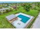 Aerial view of community pool and surrounding area at 235 Rotonda Blvd W # C203, Rotonda West, FL 33947