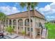 Condo building showcasing architectural details and landscaping at 235 Rotonda Blvd W # C203, Rotonda West, FL 33947