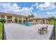 Community pool with lounge chairs and fenced-in area at 235 Rotonda Blvd W # C203, Rotonda West, FL 33947