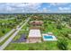 Aerial perspective of community pool and surrounding landscape at 235 Rotonda Blvd W # C203, Rotonda West, FL 33947