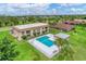 Aerial view of the community pool and surrounding buildings at 235 Rotonda Blvd W # C203, Rotonda West, FL 33947