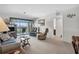 Living room with a view of the balcony and comfortable seating at 235 Rotonda Blvd W # C203, Rotonda West, FL 33947
