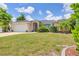 Single-story home with a two-car garage and manicured lawn at 639 Boundary Blvd, Rotonda West, FL 33947