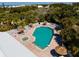 Community pool with lounge chairs and tropical landscaping at 7104 Palm Island Dr # Le38, Placida, FL 33946
