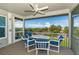 Relaxing screened porch with ocean view and seating at 7104 Palm Island Dr # Le38, Placida, FL 33946