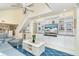 Living room with comfy sofas, built in shelving, and a large flat screen TV at 7104 Palm Island Dr # Le38, Placida, FL 33946