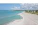 Aerial view of a beach with white sand and blue water at 7104 Palm Island Dr # Le38, Placida, FL 33946