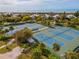 Aerial view of tennis courts with ocean view at 7104 Palm Island Dr # Le38, Placida, FL 33946