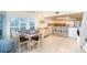 Casual dining area with a rustic table and chairs near the kitchen at 7104 Palm Island Dr # Le38, Placida, FL 33946