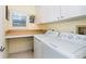 Bright laundry room with washer, dryer, and countertop at 7104 Palm Island Dr # Le38, Placida, FL 33946