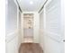 Long hallway with double closets and access to bathroom at 7104 Palm Island Dr # Le38, Placida, FL 33946