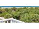 Elevated view of the ocean and lush vegetation at 7104 Palm Island Dr # Le38, Placida, FL 33946