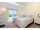 Guest bedroom with two twin beds and access to balcony at 7104 Palm Island Dr # Le38, Placida, FL 33946