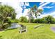 Serene canal-side bench offering scenic views at 156 Jose Gaspar Dr # 156, Englewood, FL 34223