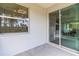 Covered patio with sliding glass doors and view of backyard at 9239 Harvester St, Port Charlotte, FL 33981