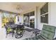 Covered patio with outdoor dining set and seating at 9239 Harvester St, Port Charlotte, FL 33981