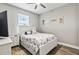 Guest bedroom with a queen bed, nightstands, and neutral decor at 9239 Harvester St, Port Charlotte, FL 33981