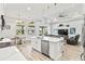 Spacious kitchen with island, stainless steel appliances, and breakfast nook at 9239 Harvester St, Port Charlotte, FL 33981