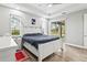 Spacious main bedroom with a king-size bed and plenty of natural light at 9239 Harvester St, Port Charlotte, FL 33981