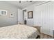 Guest bedroom with a queen-size bed and double door closet at 9239 Harvester St, Port Charlotte, FL 33981