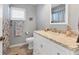 Bathroom features a marble countertop vanity, decorative faucets and lighting with matching accessories at 2516 Dixon Ter, Port Charlotte, FL 33981