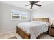 Bedroom featuring tiled floors and a window that lets in lots of light with plantation shutters for privacy at 2516 Dixon Ter, Port Charlotte, FL 33981