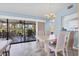 Bright dining area with views of the outdoors and access to the screened-in patio at 2516 Dixon Ter, Port Charlotte, FL 33981