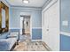 Inviting foyer featuring neutral paint and tile floors with a bench seat at 2516 Dixon Ter, Port Charlotte, FL 33981