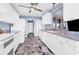 Functional kitchen with white cabinets, appliances, and a view into the dining area at 2516 Dixon Ter, Port Charlotte, FL 33981